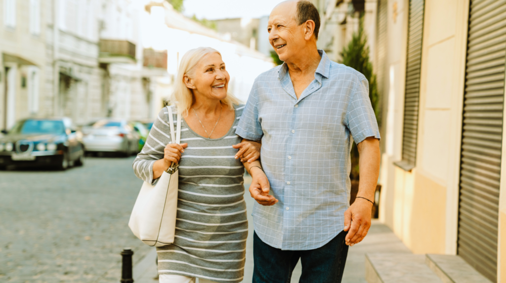 Optimum Couple Couple smiling and enjoying vacation knowing their Optimum Medicare Advantage coverage has been great for them.